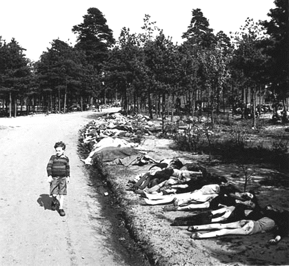 Boy walking on Belsen camp in
                                      1945 